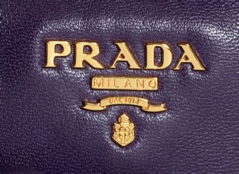 prada logo no triangle runway real or fake|prada logo meaning.